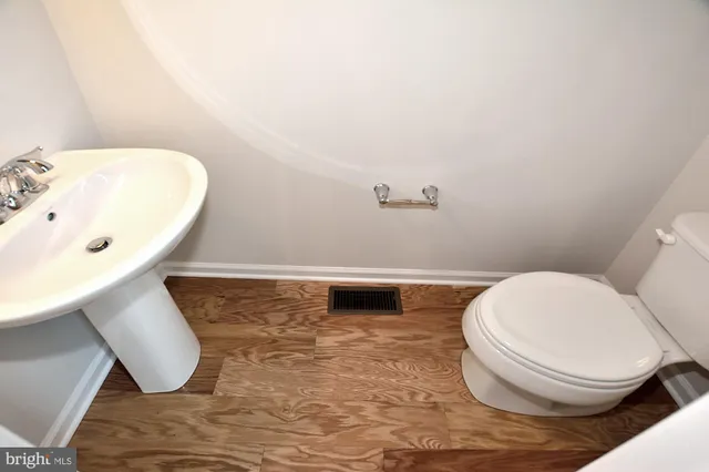 a bathroom with a toilet and a sink