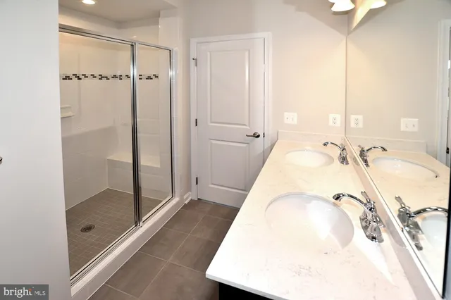 a bathroom with a tub and shower