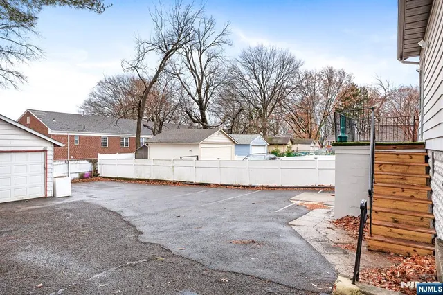 a view of a house with snow on the road