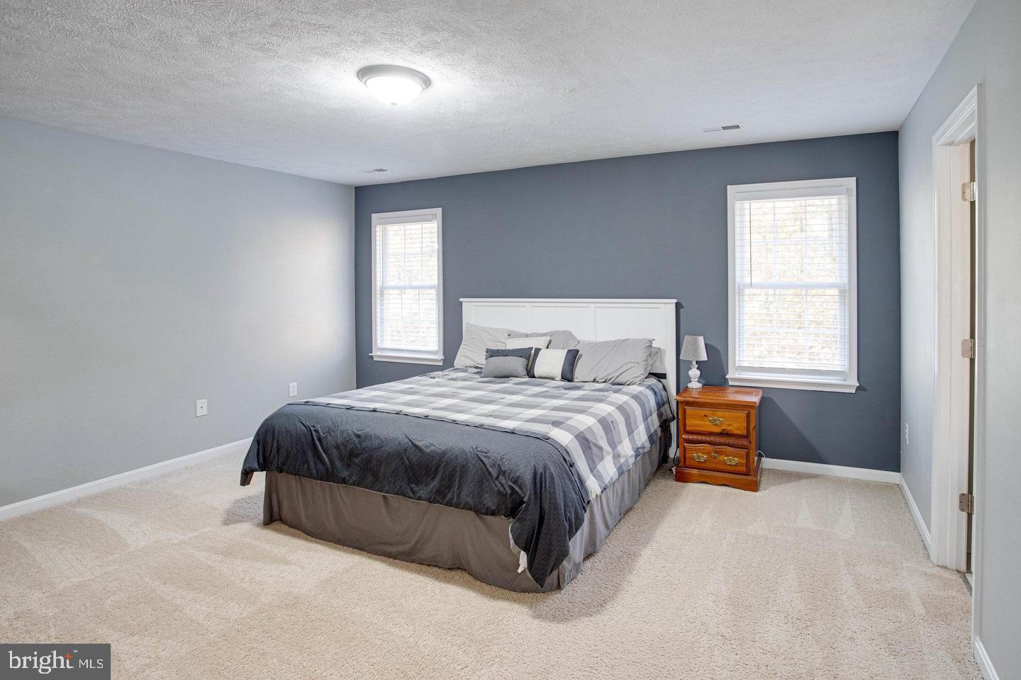 6316 Hams Ford Road Spotsylvania, VA 22551 - Photo 11 of 21 a bedroom with a bed and window