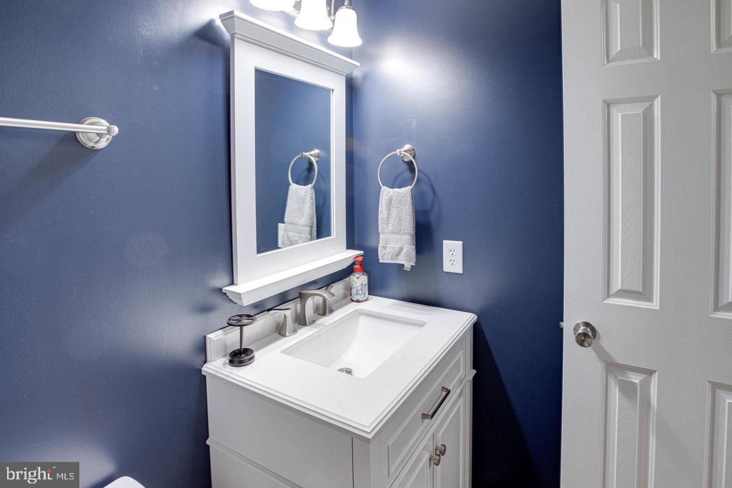 6316 Hams Ford Road Spotsylvania, VA 22551 - Photo 16 of 21 a bathroom with a sink and a mirror