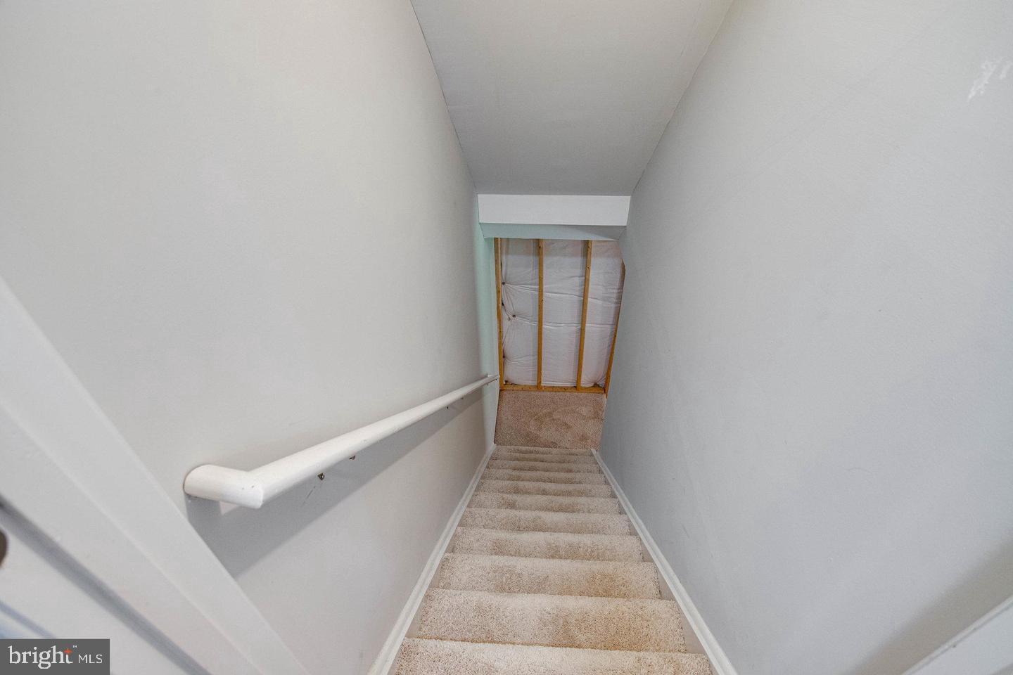 6316 Hams Ford Road Spotsylvania, VA 22551 - Photo 18 of 21 a view of a hallway with wooden floor and white walls