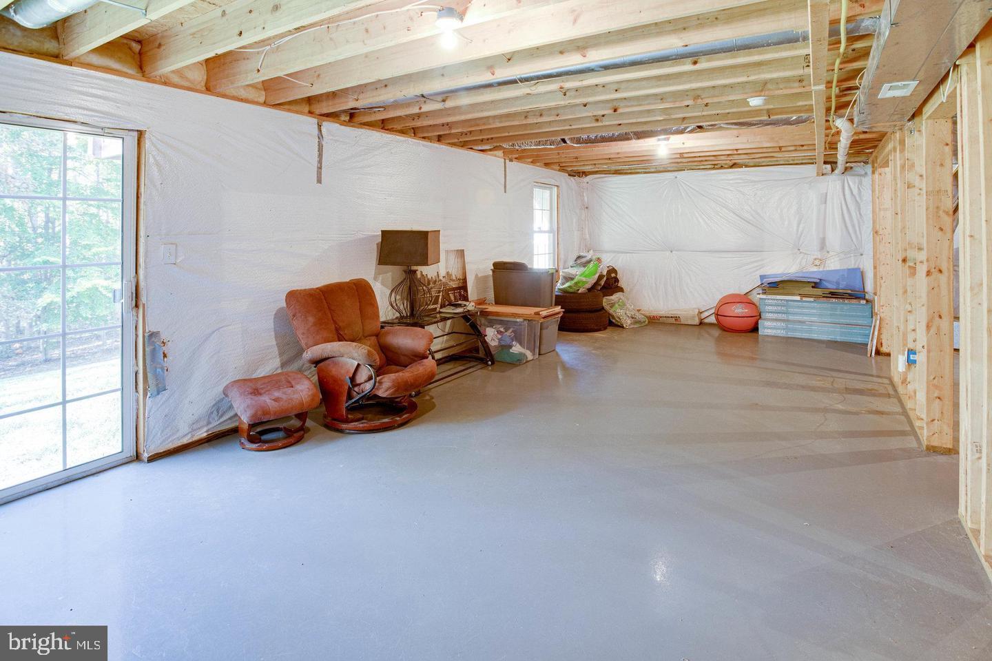 6316 Hams Ford Road Spotsylvania, VA 22551 - Photo 19 of 21 a view of a livingroom with toys and a ceiling fan
