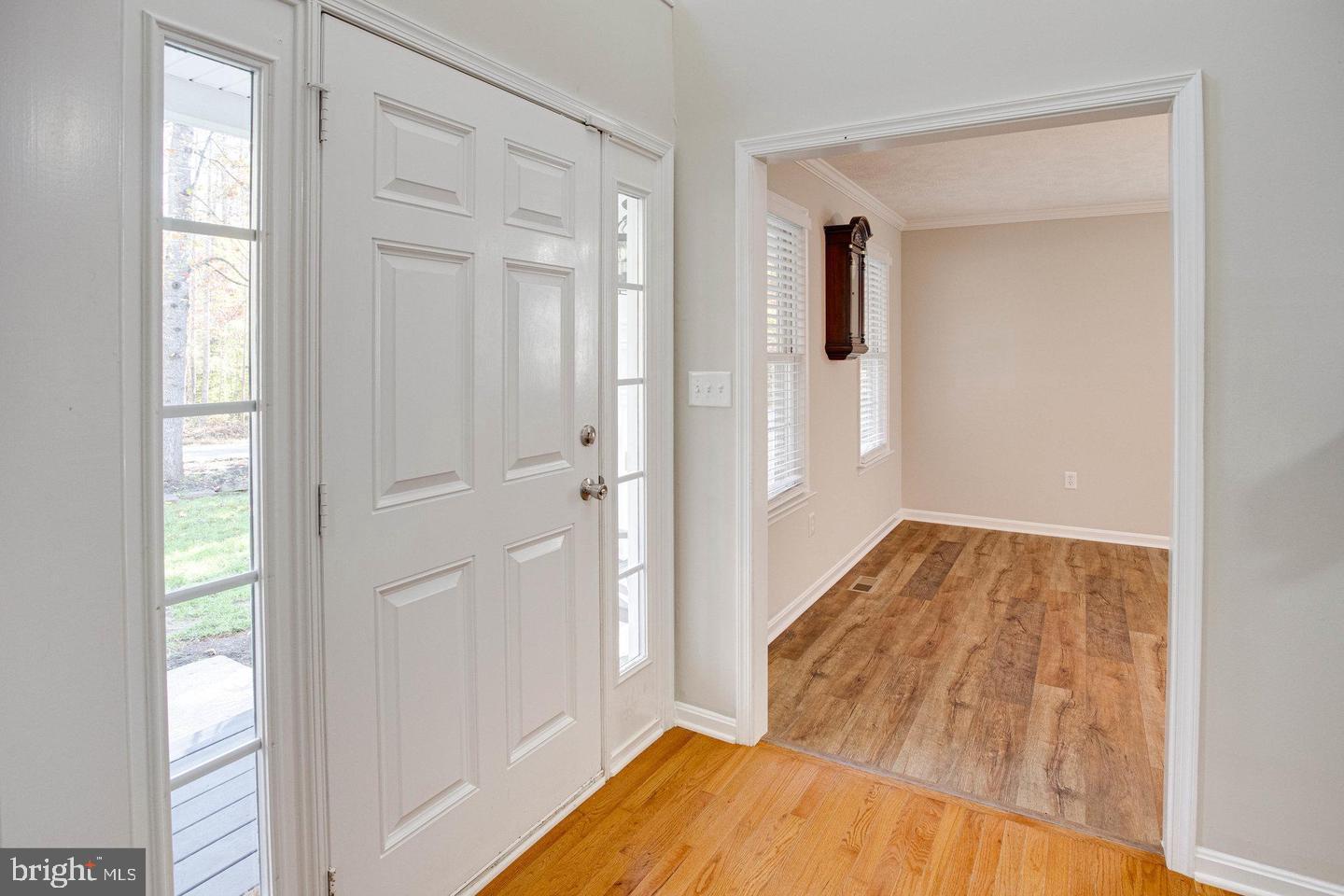 6316 Hams Ford Road Spotsylvania, VA 22551 - Photo 4 of 21 a view of a hallway with wooden floor and closet area