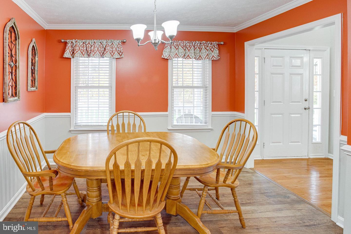 6316 Hams Ford Road Spotsylvania, VA 22551 - Photo 7 of 21 a view of a dining room with furniture window and wooden floor