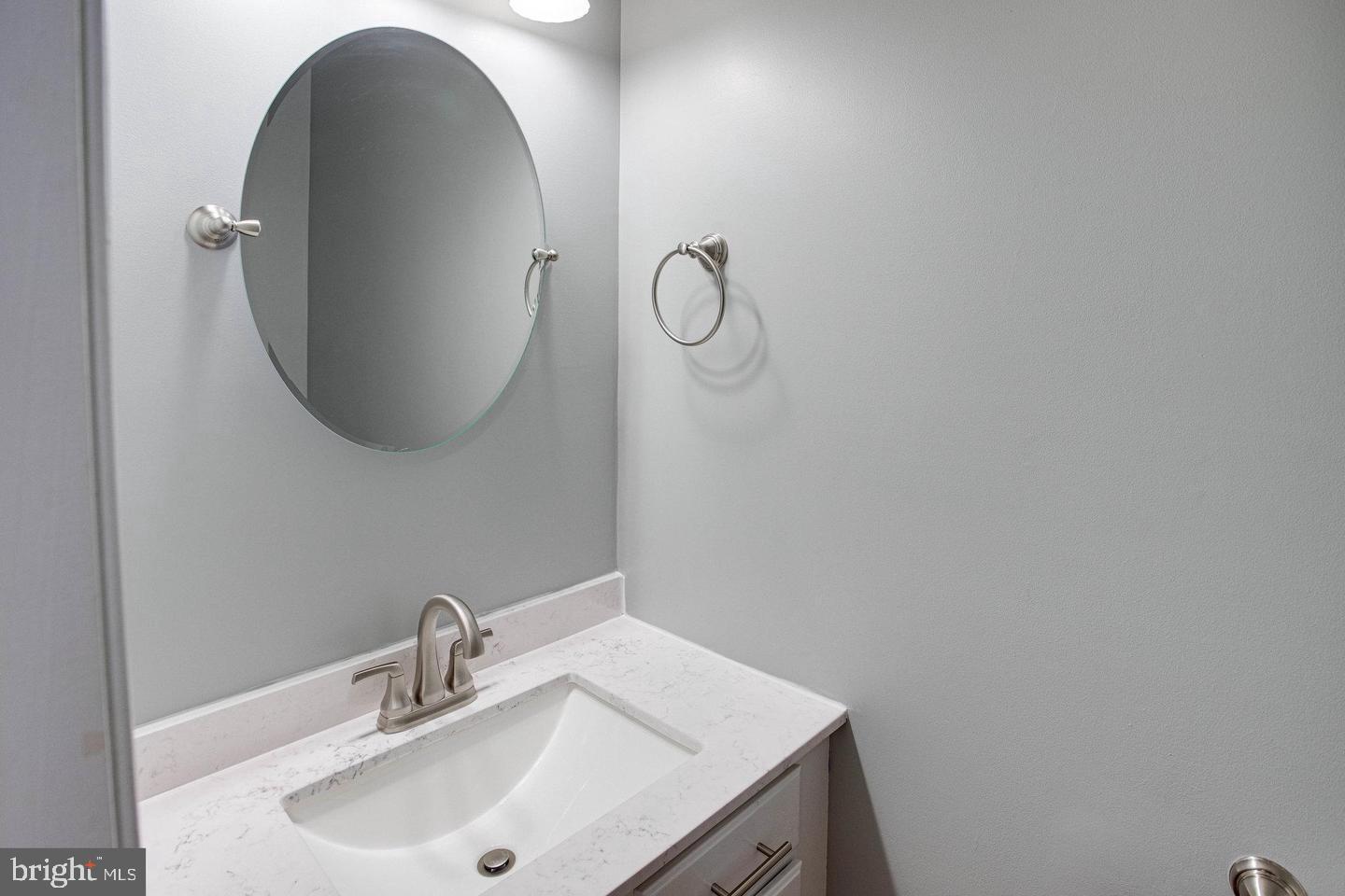 6316 Hams Ford Road Spotsylvania, VA 22551 - Photo 8 of 21 a bathroom with a sink and mirror
