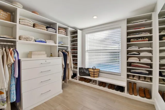 a bedroom with a bed and a chair