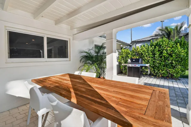 a view of a backyard with a patio