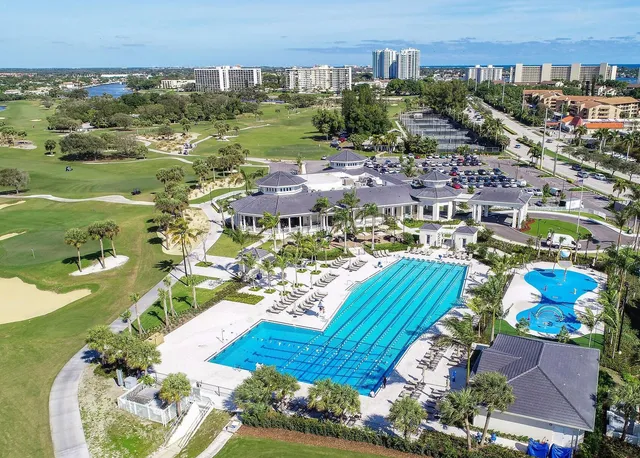a lake view with tables and chairs