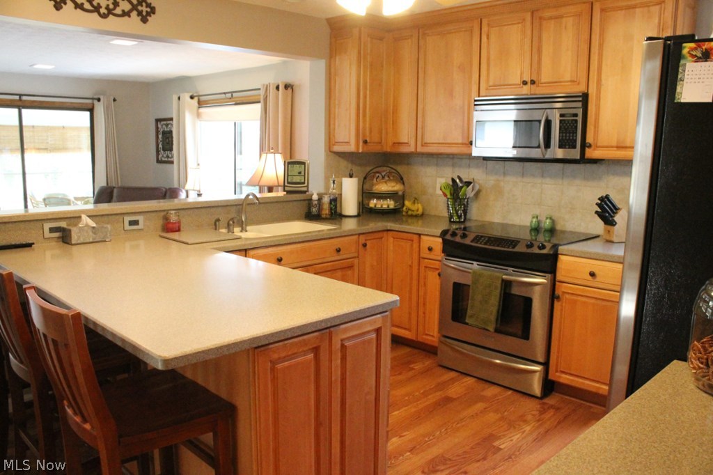 1250 Hudson Road Kent, OH 44240 - Photo 6 of 24 View from dining of ceramic backsplash & stainless kitchen.