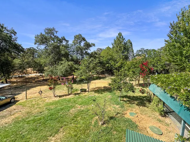 a view of a lake with a yard