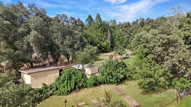 a view of outdoor space with swimming pool and green space