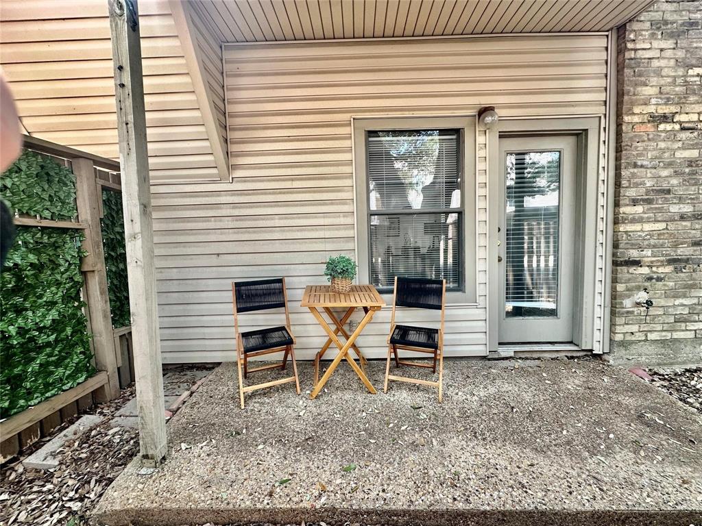 7340 Skillman Street, Unit 405 Dallas, TX 75231 - Photo 11 of 18 Private patio featuring a light-colored concrete surface
