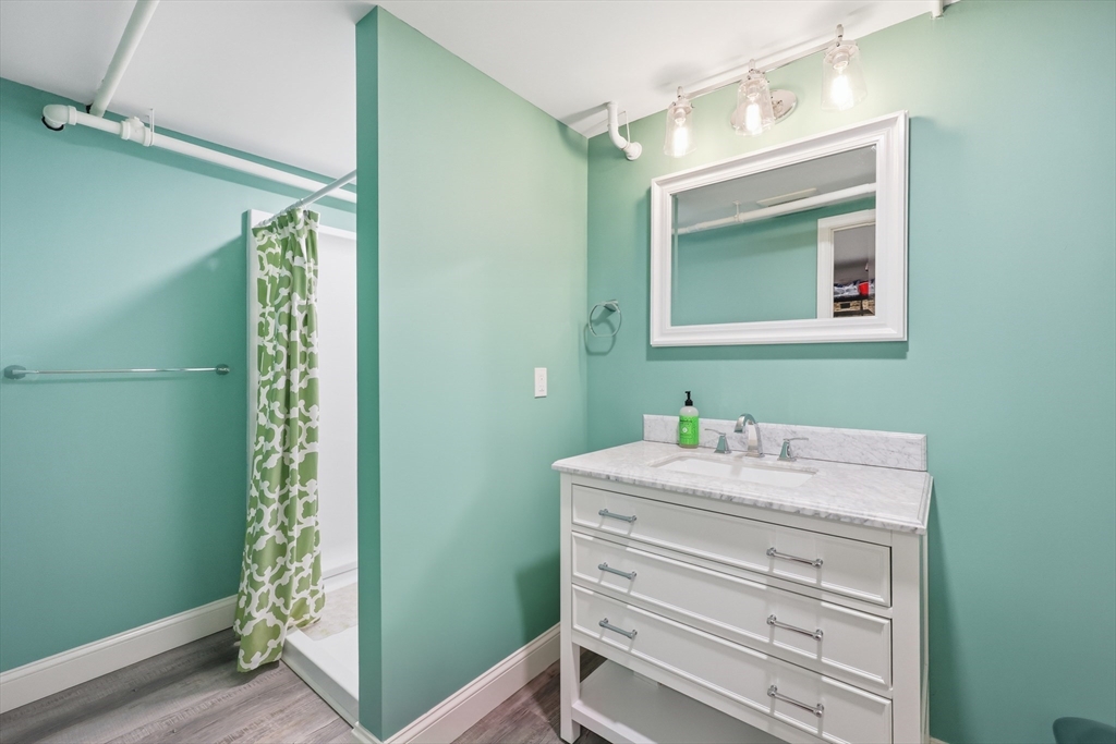 123 Englewood Road Longmeadow, MA 01106 - Photo 34 of 42 a bathroom with a mirror sink and vanity