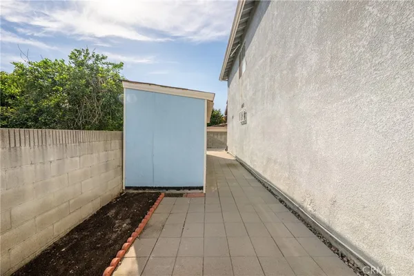 a view of a pathway gate with wooden floor