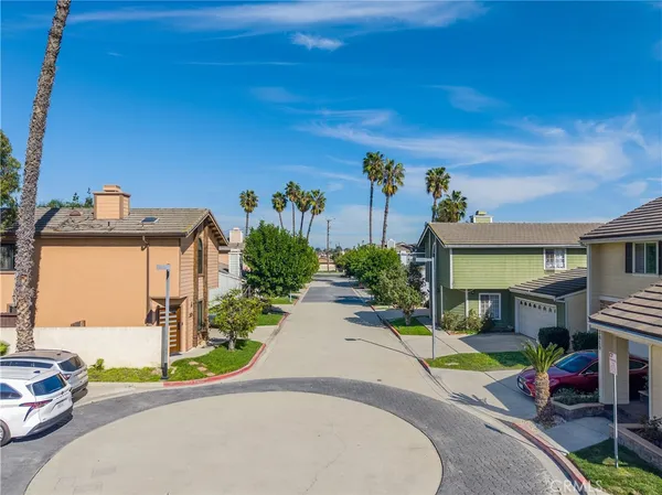 a view of a yard with a house in the background