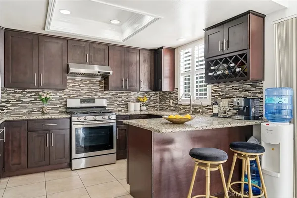 a kitchen with cabinets appliances and a sink
