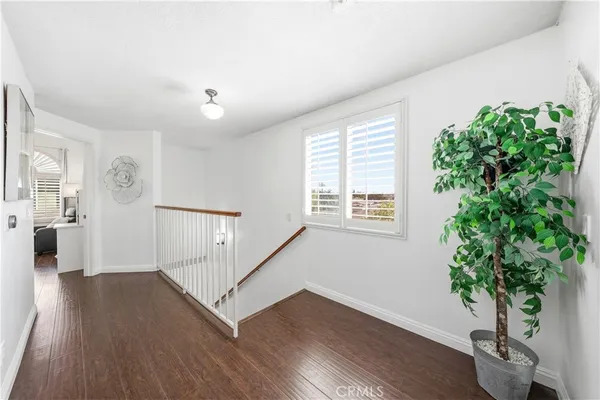 a view of entryway with wooden floor