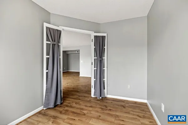 a view of entryway with wooden floor