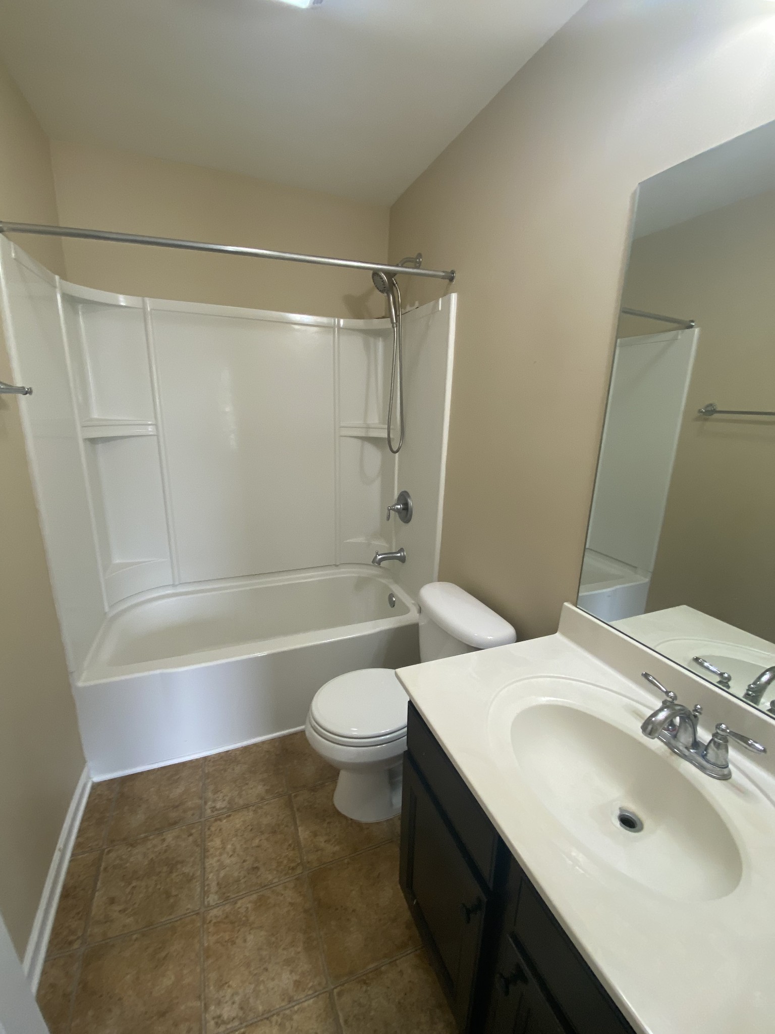 1437 Riverbrook Drive Hermitage, TN 37076 - Photo 11 of 16 a bathroom with a sink a toilet and shower