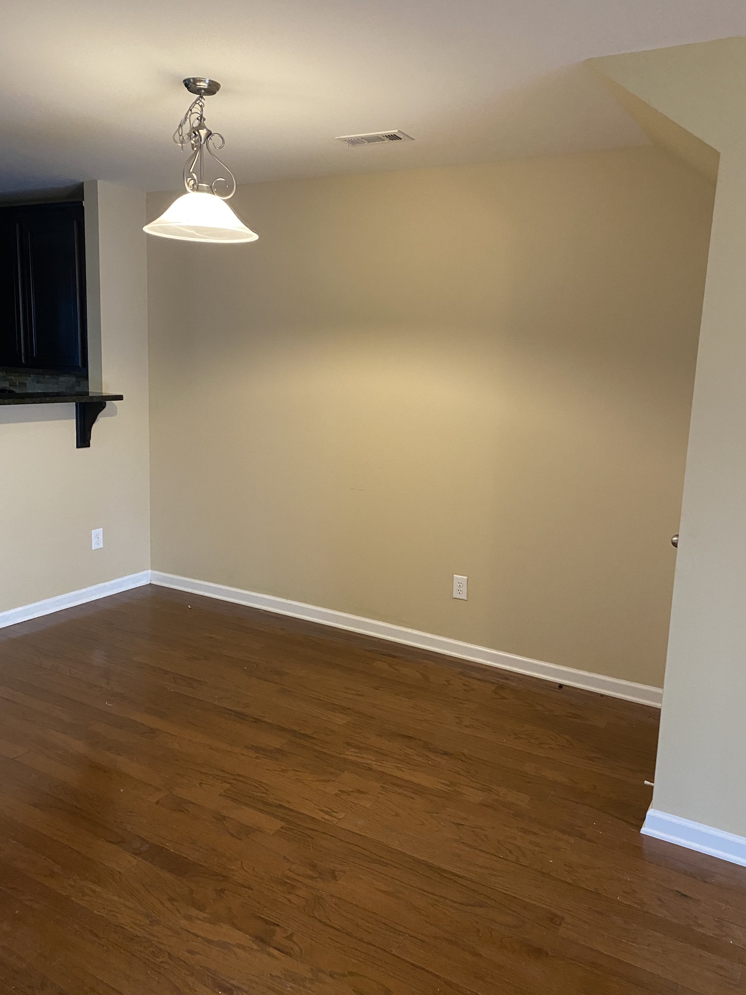1437 Riverbrook Drive Hermitage, TN 37076 - Photo 5 of 16 an empty room with wooden floor and windows