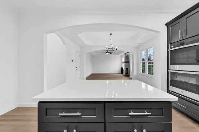 a kitchen with a sink and stainless steel appliances