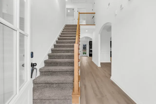 a view of an entryway with wooden floor