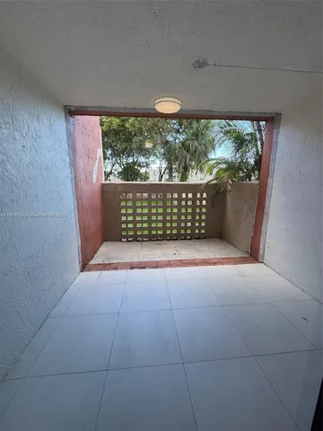 a view of a room with a large window