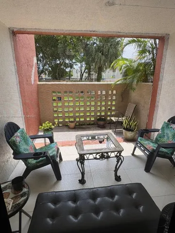 a room with furniture and a large window