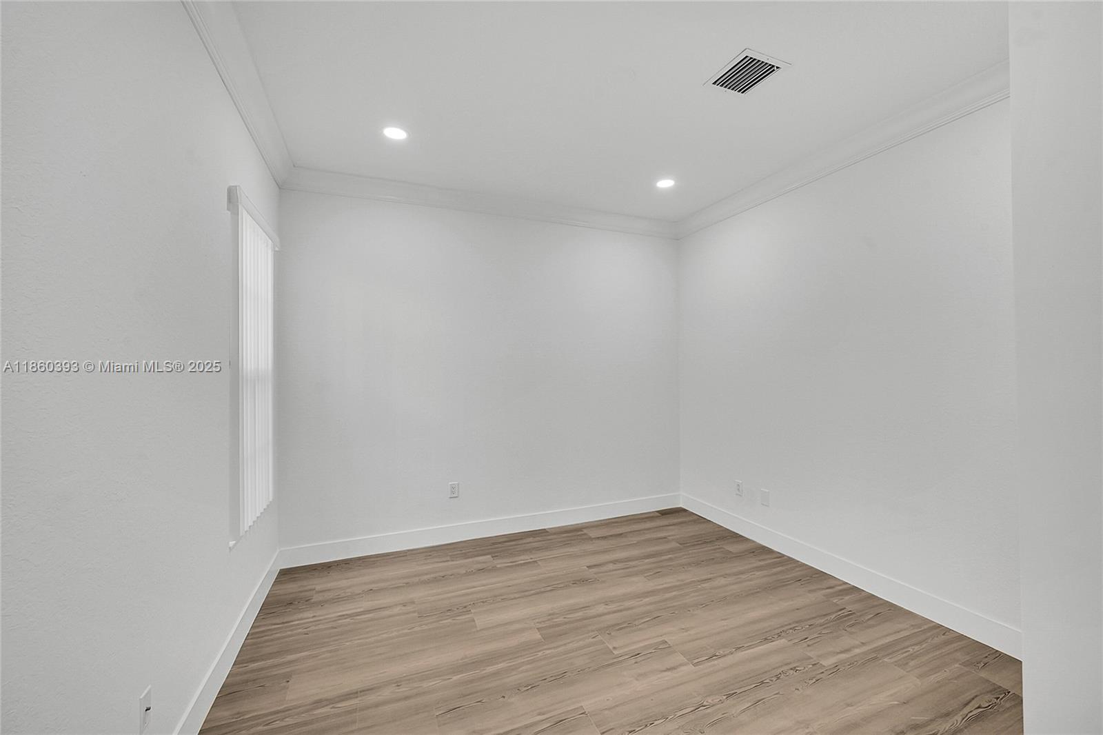 8305 Northwest 8th Terrace Boca Raton, FL 33487 - Photo 11 of 39 a view of empty room with wooden floor