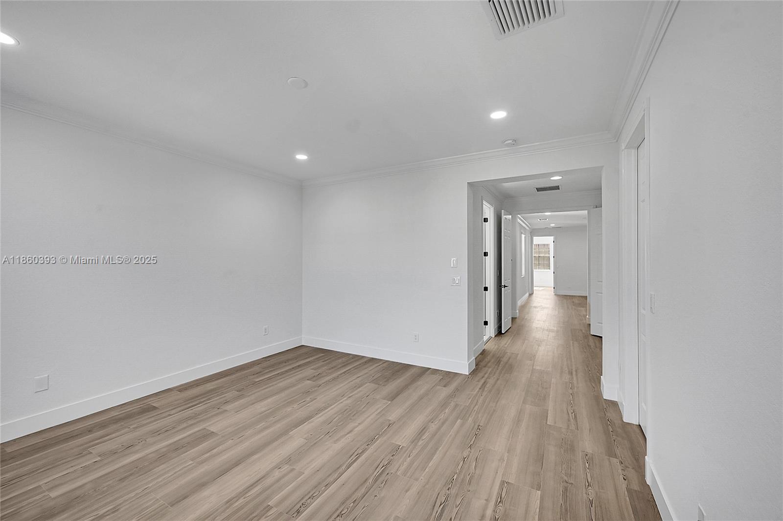 8305 Northwest 8th Terrace Boca Raton, FL 33487 - Photo 21 of 39 a view of a room with wooden floor and natural light