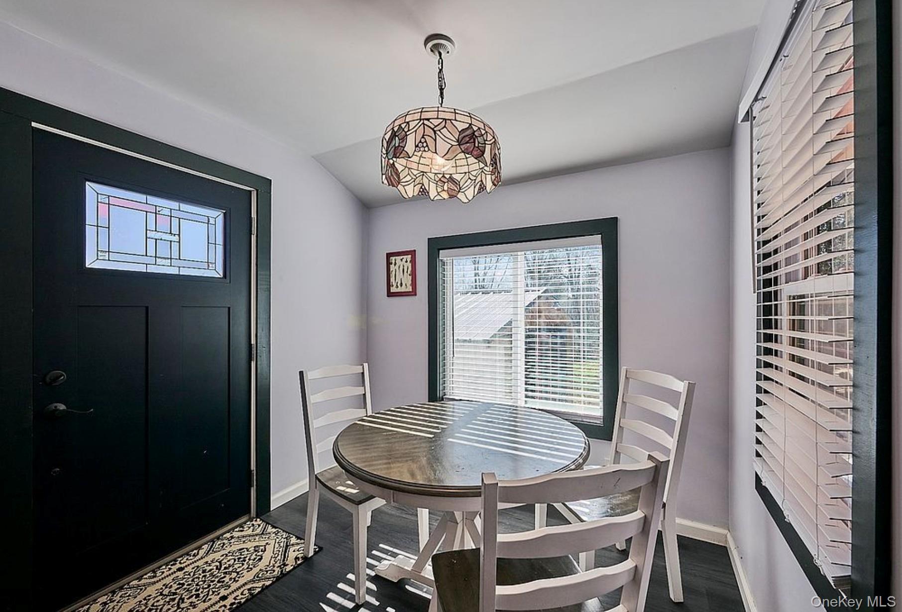 541 Cold Spring Road Monticello, NY 12701 - Photo 18 of 31 a view of a dining room with furniture and chandelier