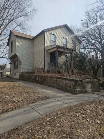 a front view of a house with garage