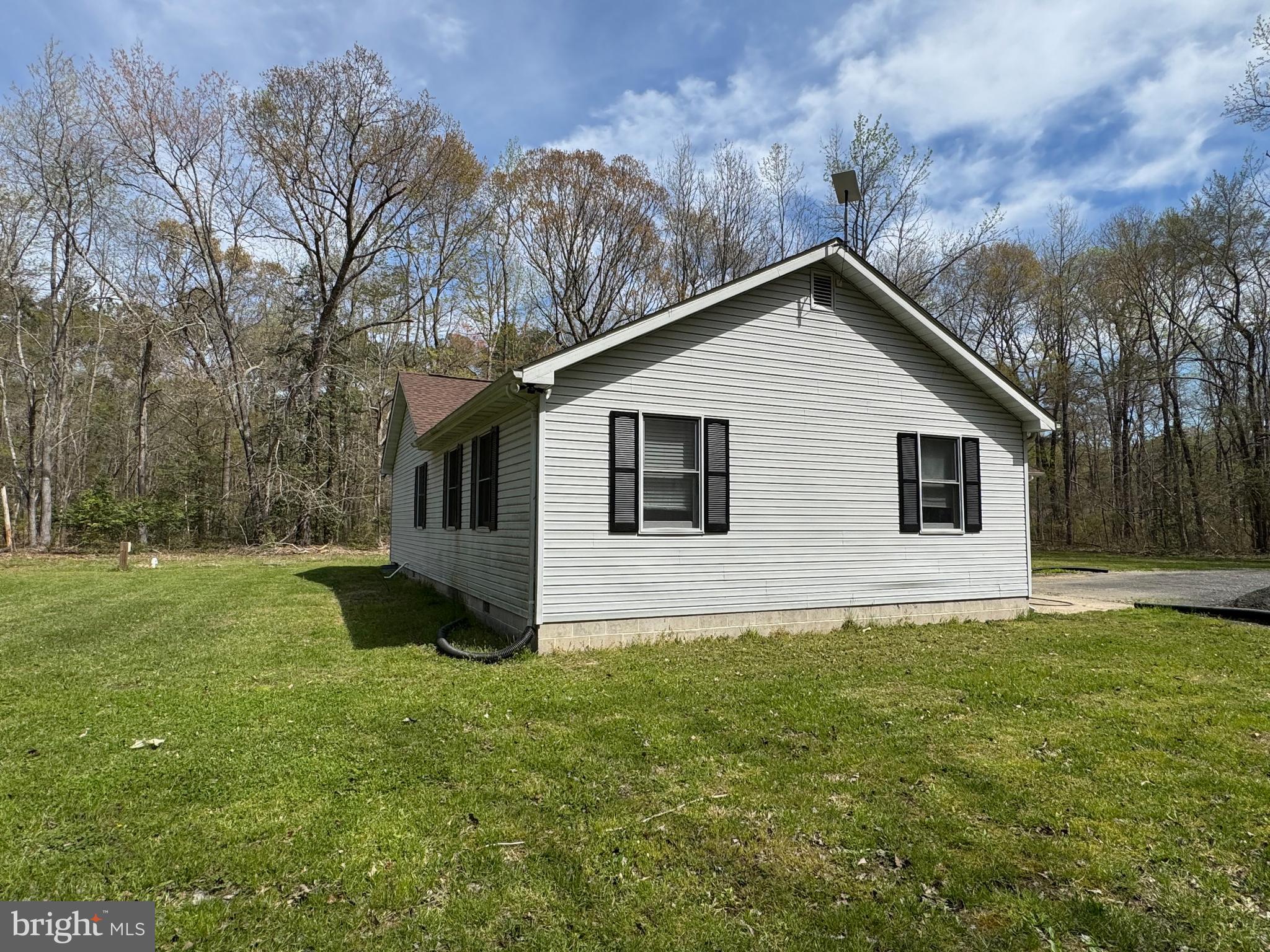18868 Hunting Club Road Georgetown, DE 19947 - Photo 23 of 29 a house that is sitting in the grass