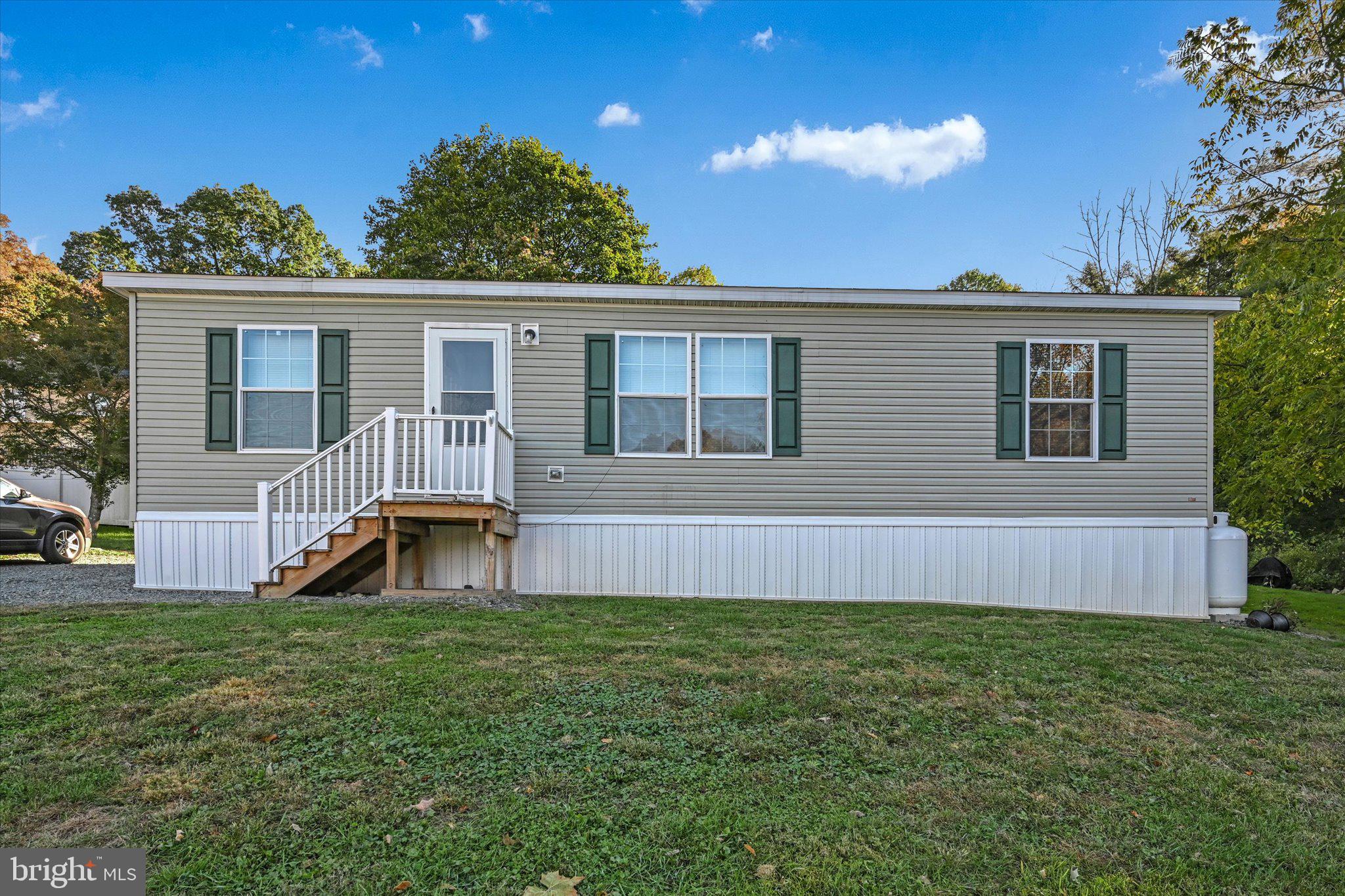 38 Squaw Circle Barto, PA 19504 - Photo 1 of 26 a front view of a house with a yard and potted plants