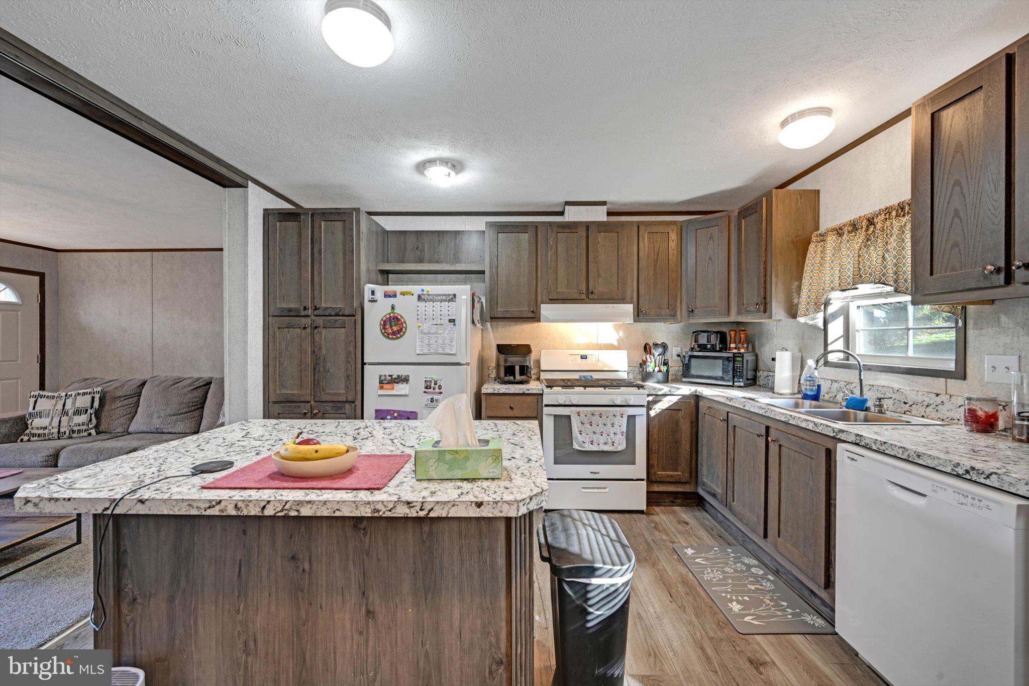 38 Squaw Circle Barto, PA 19504 - Photo 11 of 26 a kitchen with a sink a stove and refrigerator