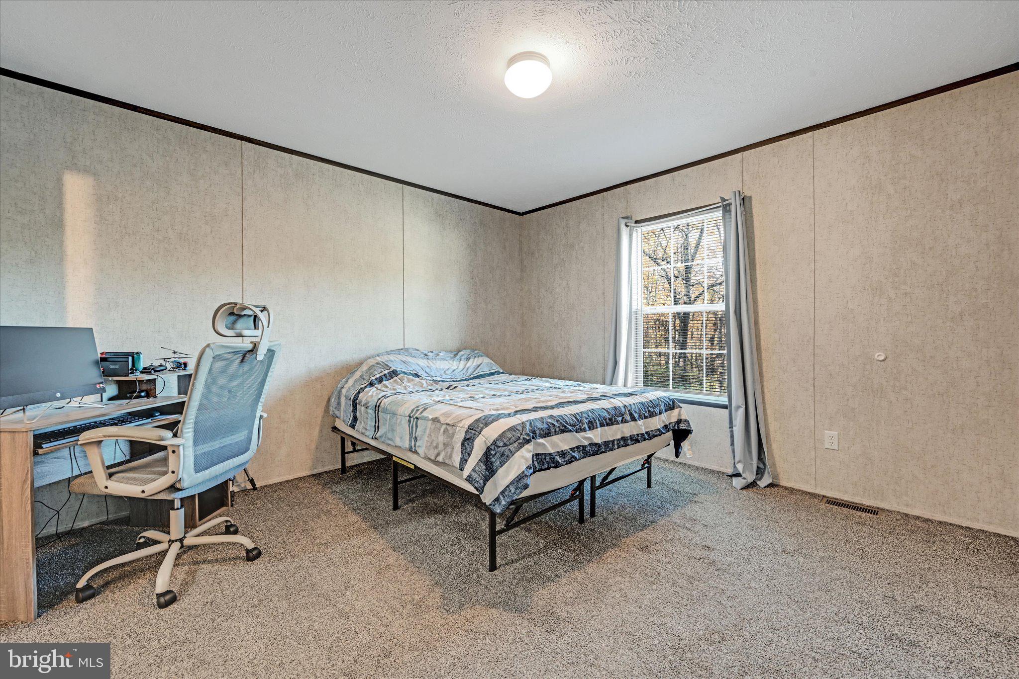 38 Squaw Circle Barto, PA 19504 - Photo 14 of 26 a bedroom with a bed chair and a window