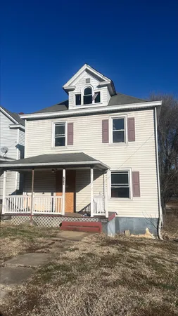 a front view of a house with garage