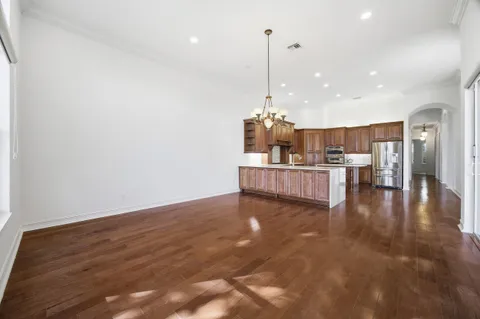 a large bathroom with a sink a large mirror and a bathtub next to a window