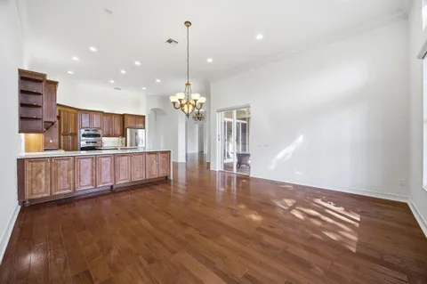 a kitchen with stainless steel appliances granite countertop a stove and a refrigerator
