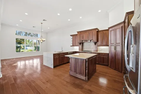 a view of kitchen with window and wooden floor