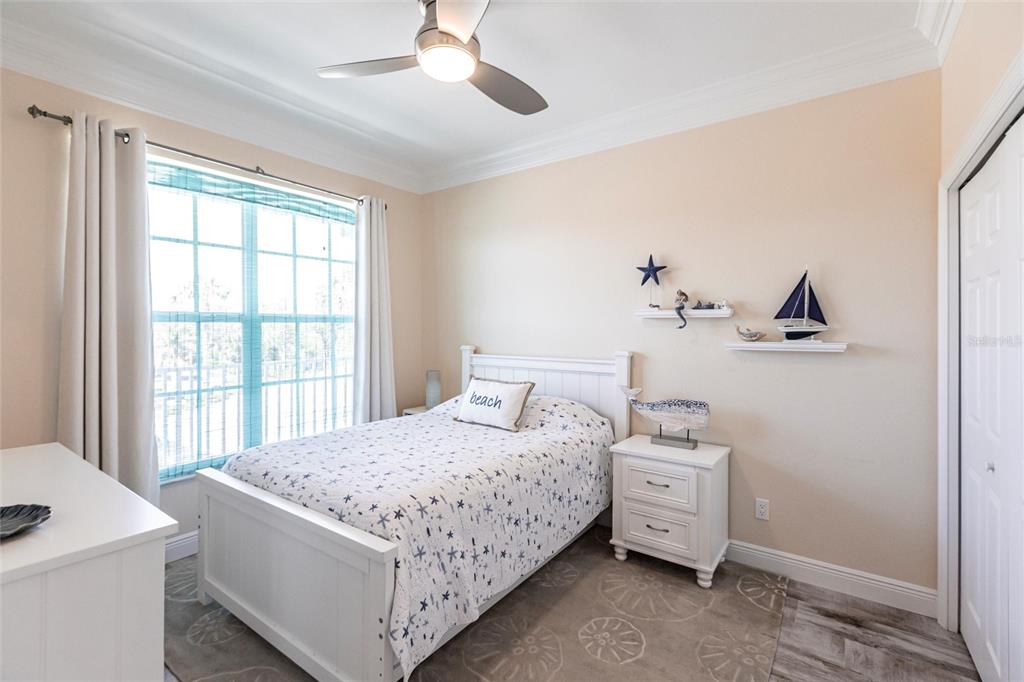 2002 Bal Harbor Boulevard, Unit 1022 Punta Gorda, FL 33950 - Photo 14 of 32 a bedroom with a bed and a window