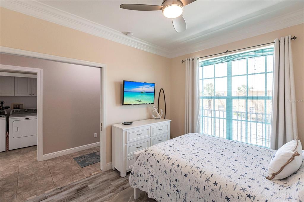 2002 Bal Harbor Boulevard, Unit 1022 Punta Gorda, FL 33950 - Photo 15 of 32 a bedroom with a bed and a window