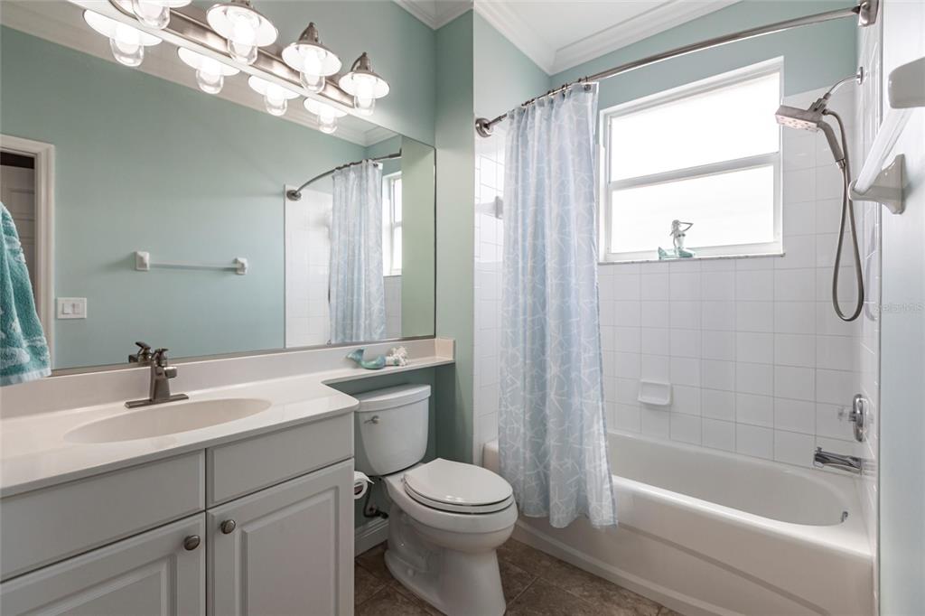 2002 Bal Harbor Boulevard, Unit 1022 Punta Gorda, FL 33950 - Photo 16 of 32 a bathroom with a sink a toilet and a bathtub