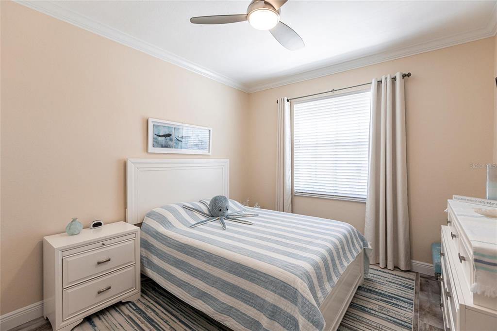 2002 Bal Harbor Boulevard, Unit 1022 Punta Gorda, FL 33950 - Photo 17 of 32 a bedroom with a bed and a window