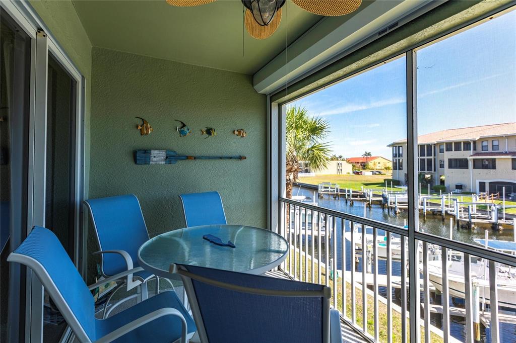 2002 Bal Harbor Boulevard, Unit 1022 Punta Gorda, FL 33950 - Photo 21 of 32 a view of a dining room with furniture window and outside view