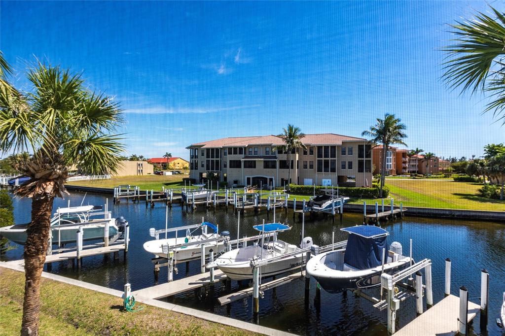 2002 Bal Harbor Boulevard, Unit 1022 Punta Gorda, FL 33950 - Photo 22 of 32 a view of a chairs and table in a patio