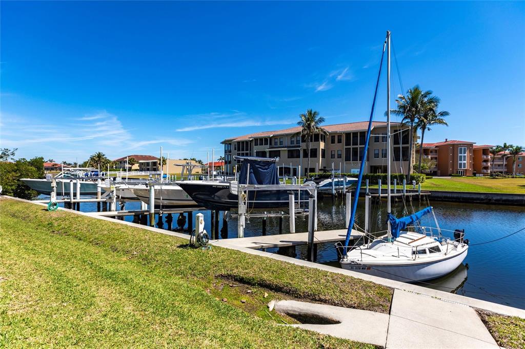 2002 Bal Harbor Boulevard, Unit 1022 Punta Gorda, FL 33950 - Photo 23 of 32 a view of a lake with a house