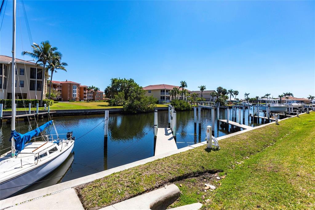 2002 Bal Harbor Boulevard, Unit 1022 Punta Gorda, FL 33950 - Photo 24 of 32 a view of a lake with boats and a bridge
