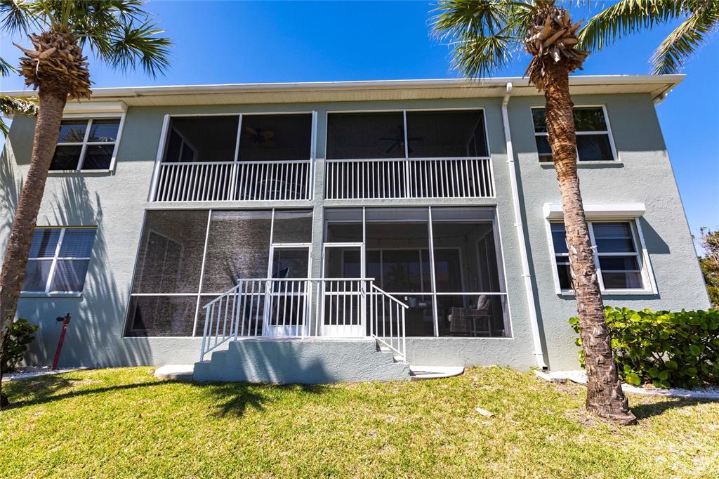 2002 Bal Harbor Boulevard, Unit 1022 Punta Gorda, FL 33950 - Photo 26 of 32 a front view of a house with a yard